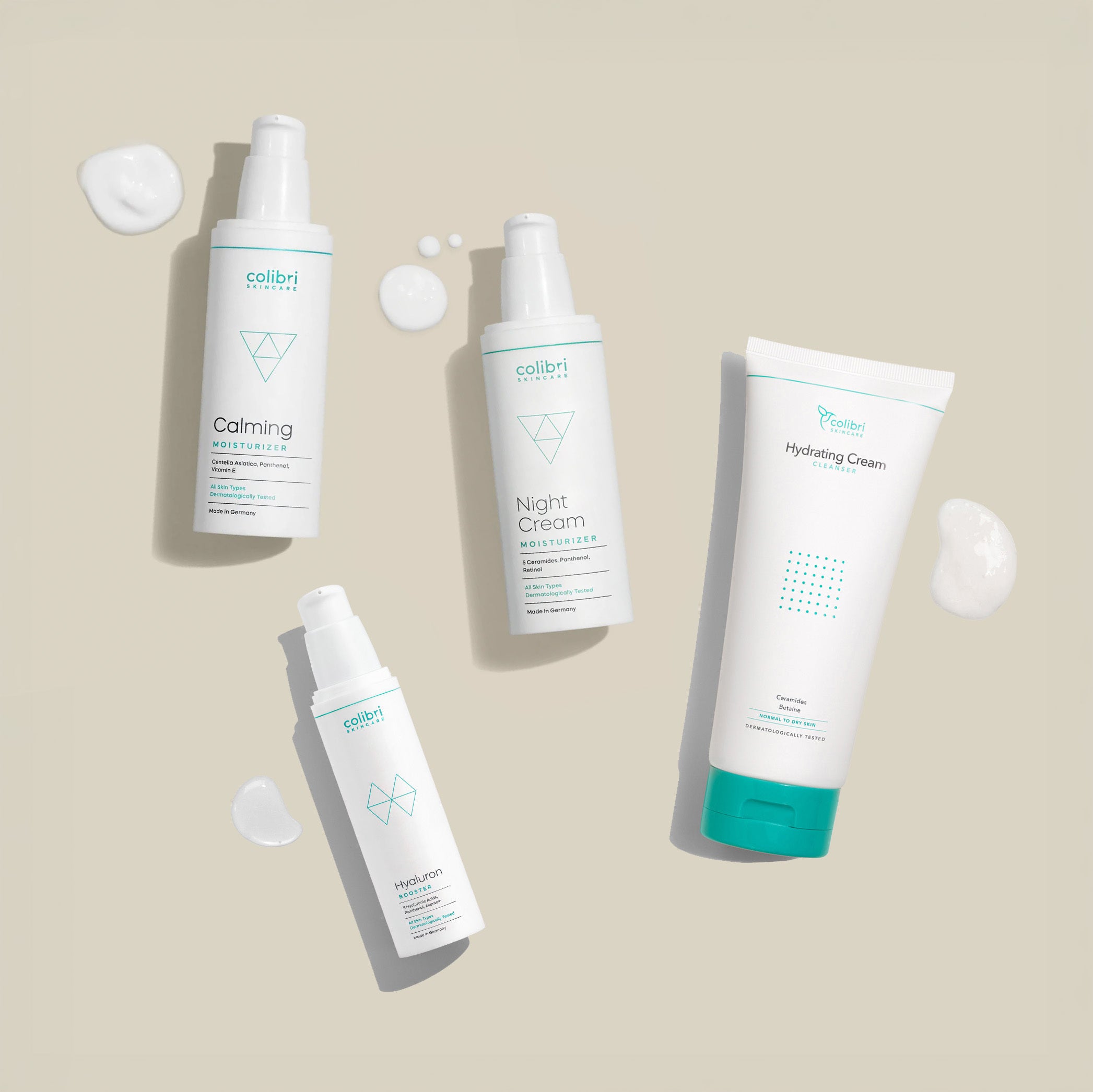 hydrating Cream Clenaser, Hyaluron Booster, Calming Moisturizer und Night Cream Flaschen mit Klecks